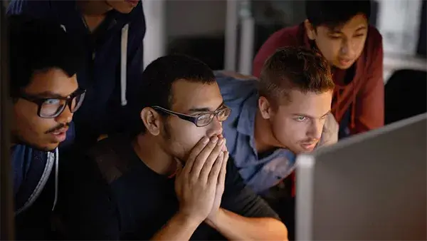 Concerned developers viewing a computer screen